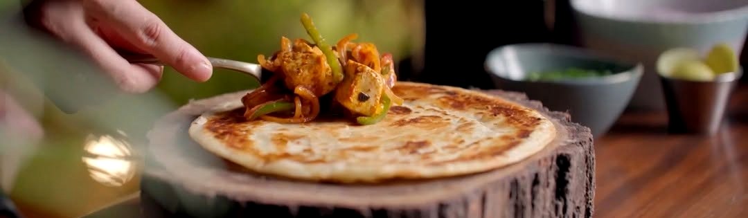Tropical Roots Kerala porotta, plated in Cochin
